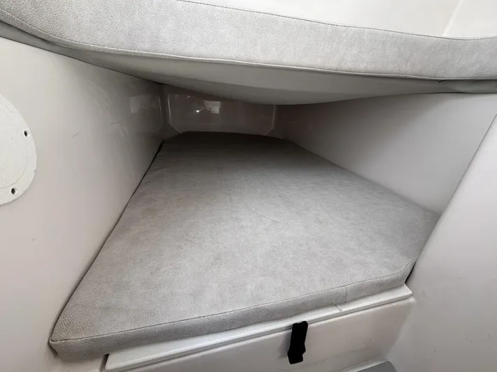  Yacht Photos Pics 2023 Sea Fox 328 Commander cabin interior with cushioned sleeping area.