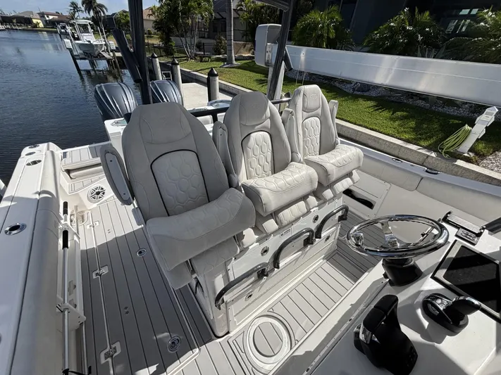  Yacht Photos Pics 2023 Sea Fox 328 Commander boat interior with luxurious seating and modern controls.