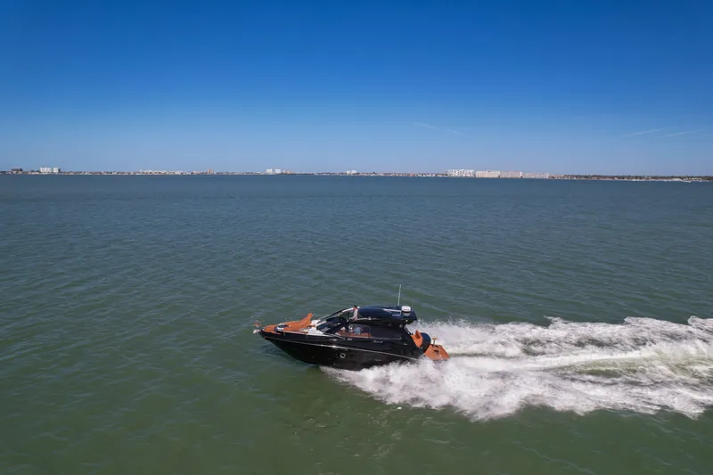  Yacht Photos Pics 2026 Hanover 355 boat cruising on open water under clear blue sky.