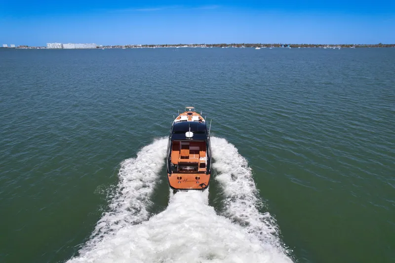  Yacht Photos Pics 2026 Hanover 355 boat cruising on open water under clear blue sky.