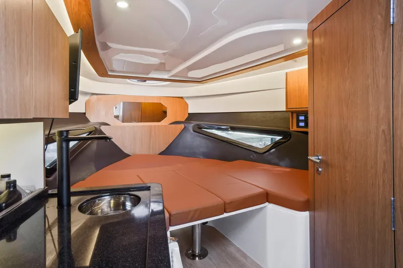  Yacht Photos Pics Interior of 2026 Hanover 355 boat with modern design and cozy sleeping area.