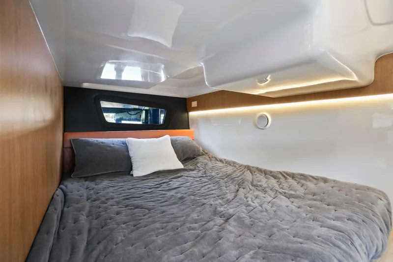  Yacht Photos Pics Cozy interior of 2026 Hanover 355 with plush bedding and modern design.