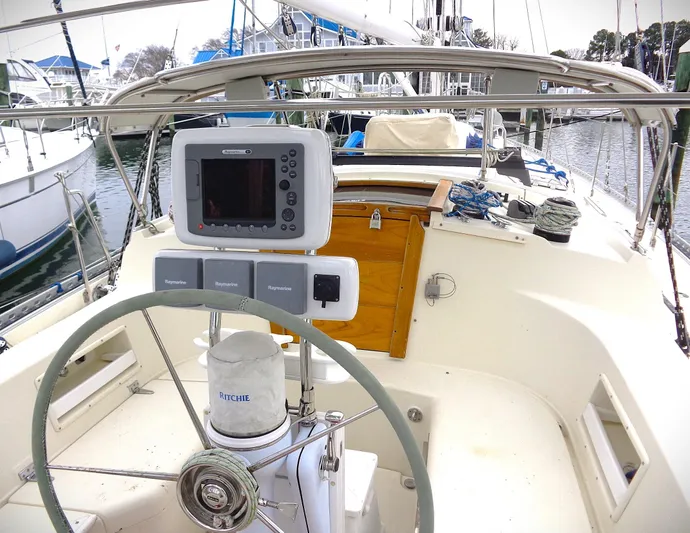 Azure Yacht Photos Pics 2005 Pacific Seacraft 40 sailboat cockpit with steering wheel and navigation equipment.