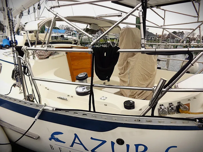 Azure Yacht Photos Pics Pacific Seacraft 40 sailboat, 2005 model, docked with covered cockpit and visible rigging.