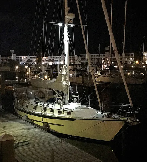 Azure Yacht Photos Pics 2005 Pacific Seacraft 40 sailboat docked at night in a marina.
