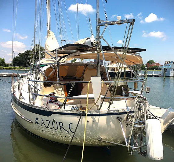 Azure Yacht Photos Pics 2005 Pacific Seacraft 40 sailboat docked in a marina under a clear blue sky.