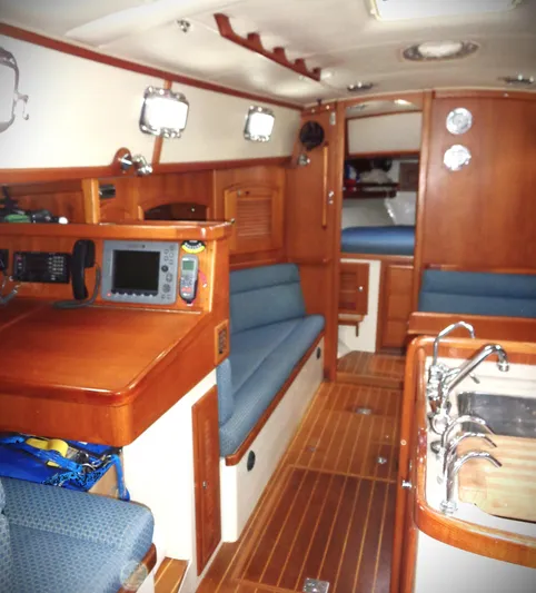 Azure Yacht Photos Pics Interior of 2005 Pacific Seacraft 40 sailboat with wood finish and navigation equipment.