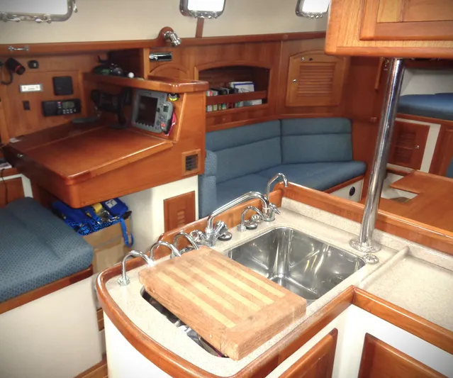 Azure Yacht Photos Pics Interior of 2005 Pacific Seacraft 40 sailboat with kitchen and seating area.