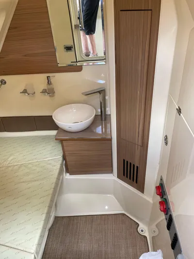  Yacht Photos Pics 2019 Chris-Craft Catalina 30 interior with modern sink and wood accents.