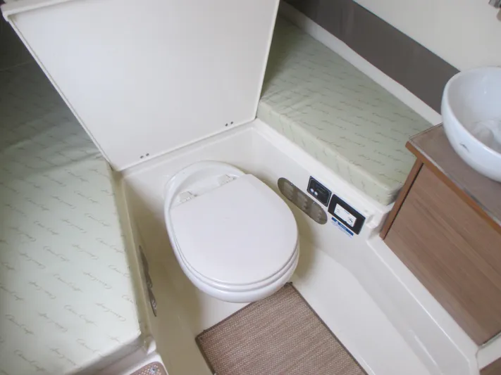  Yacht Photos Pics 2019 Chris-Craft Catalina 30 boat interior with toilet and sink.