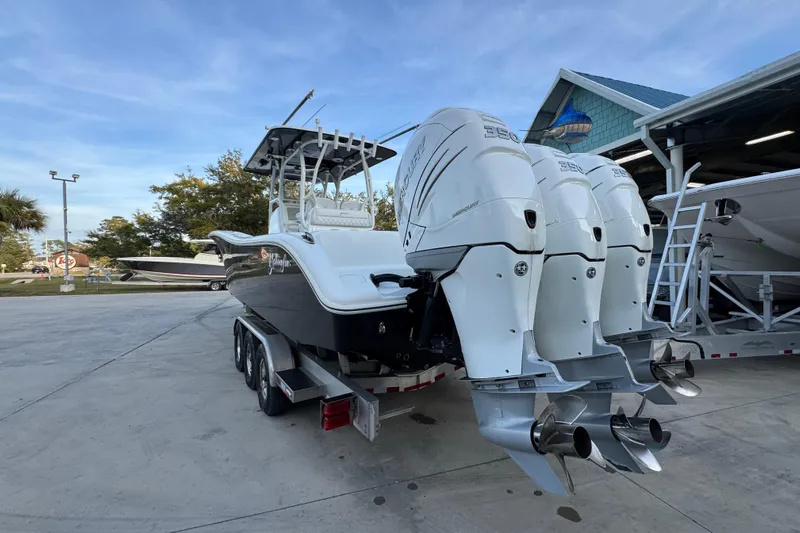  Yacht Photos Pics 2019 Yellowfin 34 Offshore boat with triple outboard engines on a trailer.