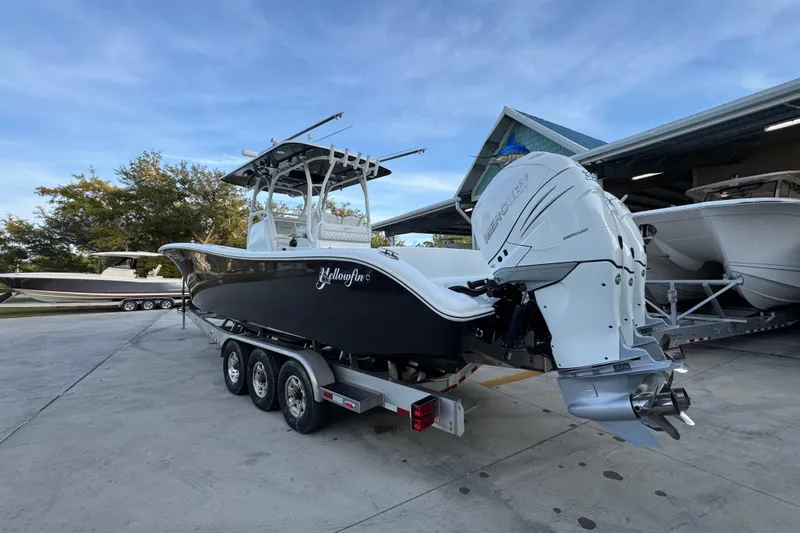  Yacht Photos Pics 2019 Yellowfin 34 Offshore boat on trailer, featuring powerful Mercury outboard engines.