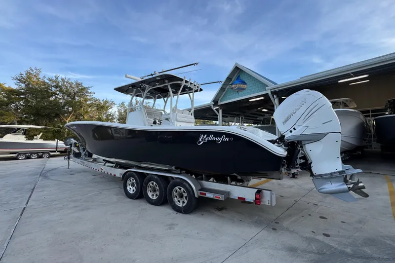  Yacht Photos Pics 2019 Yellowfin 34 Offshore boat on trailer, parked outdoors near a marina.