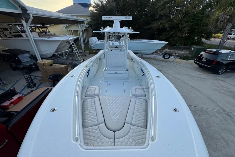  Yacht Photos Pics 2019 Yellowfin 34 Offshore boat with spacious deck and seating, docked at a marina.