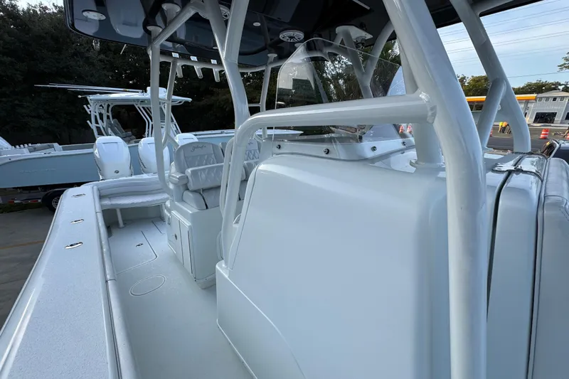 Yacht Photos Pics 2019 Yellowfin 34 Offshore boat interior with seating and console, showcasing sleek design.