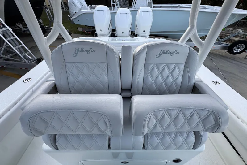  Yacht Photos Pics 2019 Yellowfin 34 Offshore boat with luxurious diamond-stitched seats and dual outboard motors.