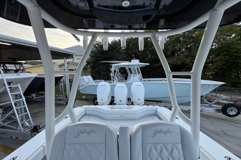  Yacht Photos Pics 2019 Yellowfin 34 Offshore boat with triple engines, docked in a marina setting.