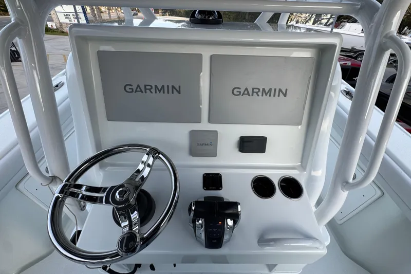  Yacht Photos Pics 2019 Yellowfin 34 Offshore boat console with dual Garmin displays and steering wheel.
