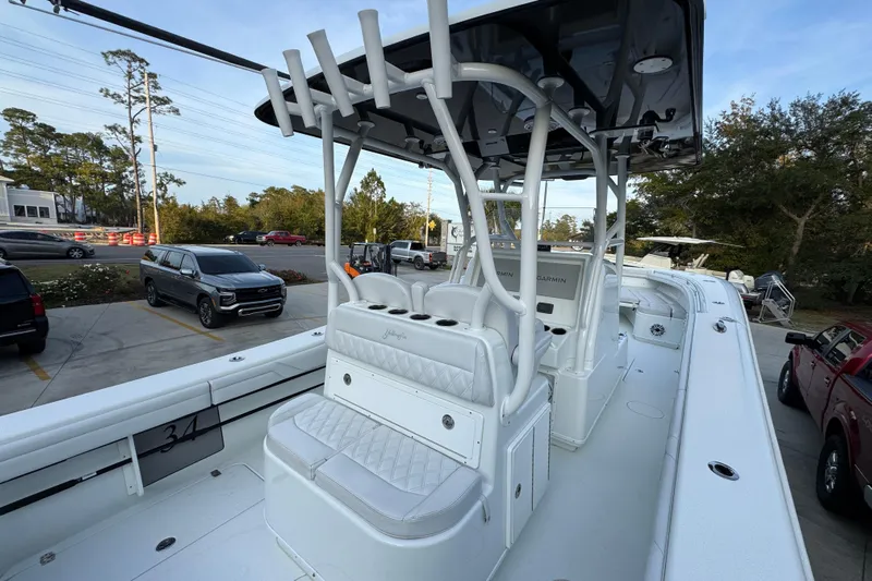  Yacht Photos Pics 2019 Yellowfin 34 Offshore boat with white seating and console, parked outdoors.