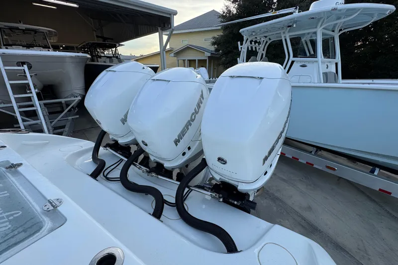  Yacht Photos Pics 2019 Yellowfin 34 Offshore with triple Mercury outboard engines in a boatyard.
