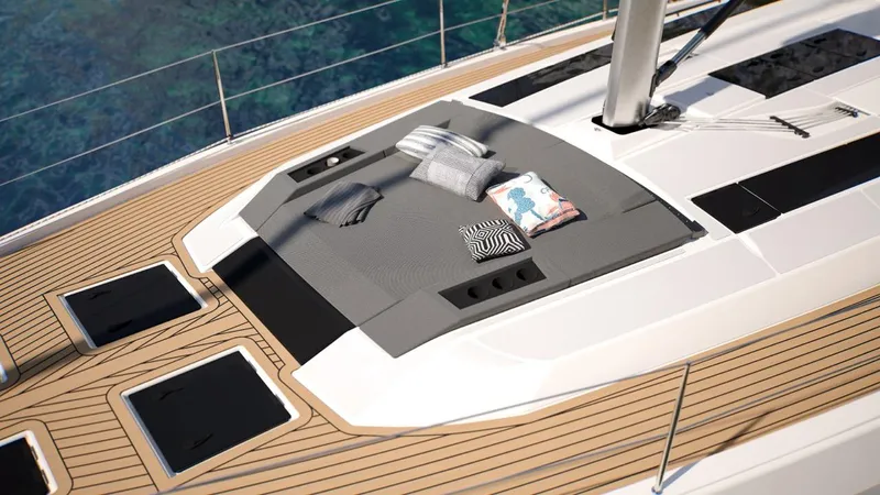 Yacht Photos Pics Luxurious 2026 Dufour 54 yacht deck with cushions, showcasing elegant design and comfort.