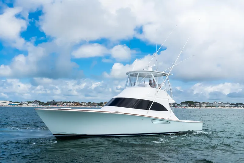 2026 46' Viking 46 Billfish Yacht Photos Pics 2026 Viking 46 Billfish yacht cruising on open water under a cloudy sky.