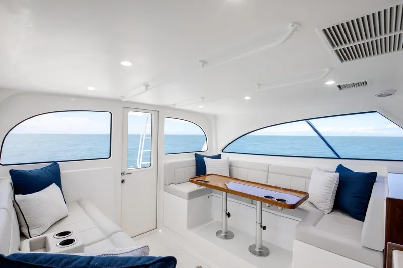 2026 46' Viking 46 Billfish Yacht Photos Pics Luxurious interior of 2026 Viking 46 Billfish yacht with ocean view and plush seating.