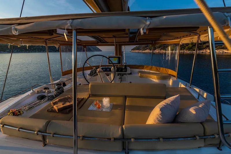  Yacht Photos Pics Luxurious 2018 Lagoon 52 F yacht interior with plush seating and scenic ocean view.