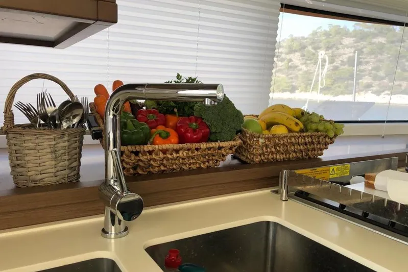  Yacht Photos Pics Kitchen on 2018 Lagoon 52 F yacht with fresh fruits and vegetables in baskets.