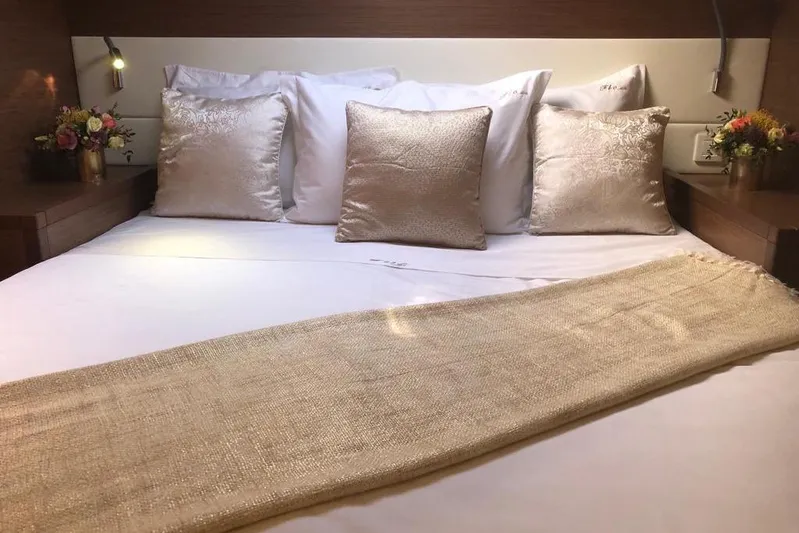  Yacht Photos Pics Luxurious bedroom interior on 2018 Lagoon 52 F yacht with elegant bedding and decor.