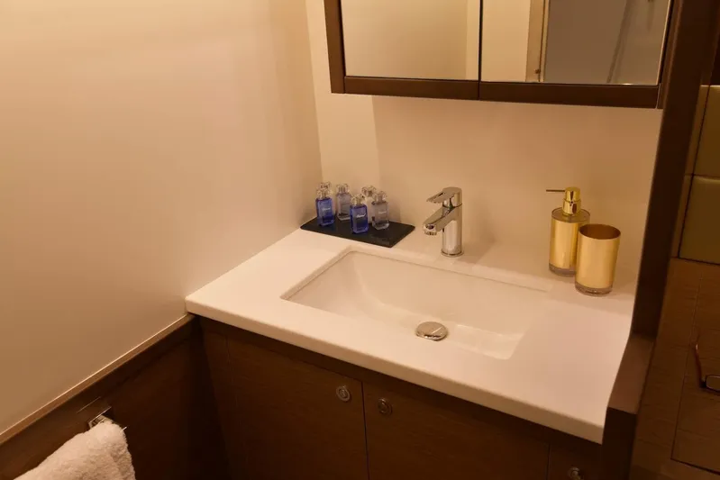  Yacht Photos Pics Luxurious bathroom sink area on a 2018 Lagoon 52 F yacht, featuring modern fixtures.