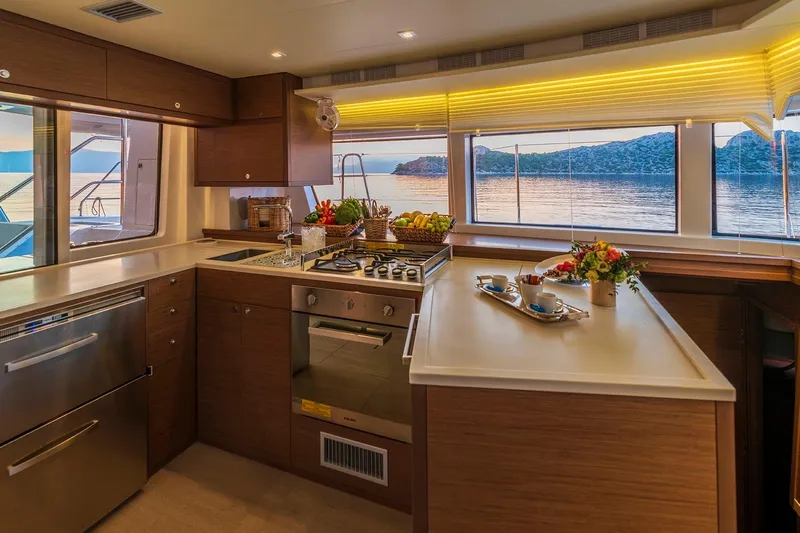  Yacht Photos Pics Luxurious kitchen interior of 2018 Lagoon 52 F yacht with scenic ocean view.