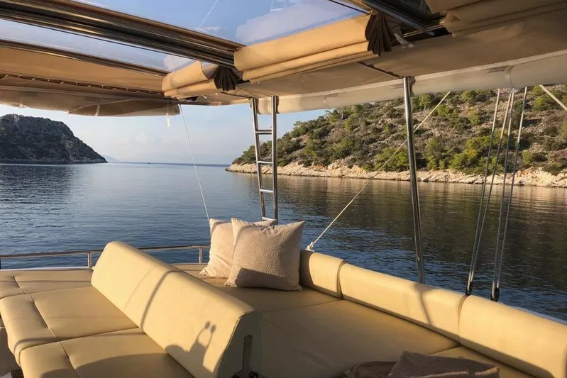  Yacht Photos Pics Luxurious Lagoon 52 F yacht interior with scenic coastal view, 2018 model.