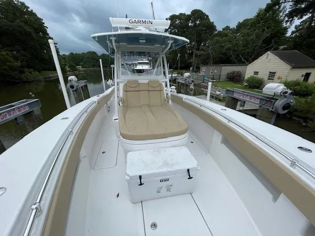  Yacht Photos Pics 2022 Invincible 36 Open Fisherman boat docked, featuring spacious seating and Garmin equipment.