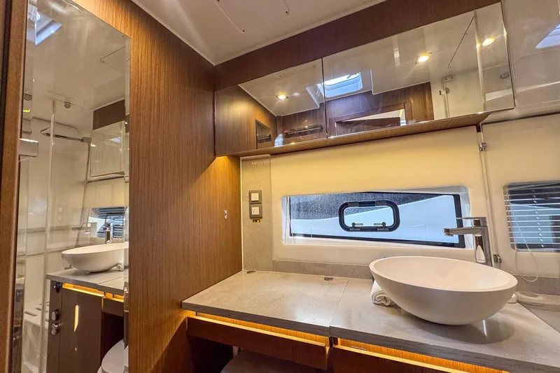 Trade In Yacht Photos Pics Luxurious bathroom interior of 2022 Jeanneau Leader 12.5 WA yacht with modern fixtures.