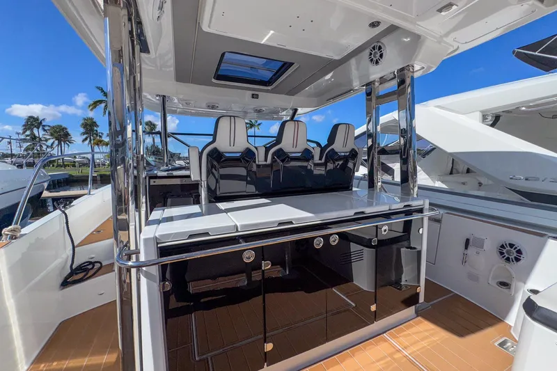 Trade In Yacht Photos Pics 2022 Jeanneau Leader 12.5 WA boat interior with sleek seating and modern design.