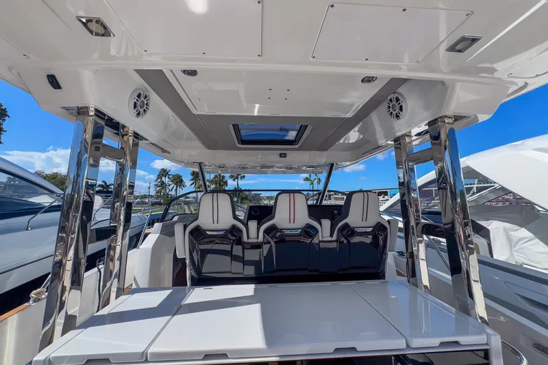 Trade In Yacht Photos Pics 2022 Jeanneau Leader 12.5 WA interior with sleek seating and modern design.