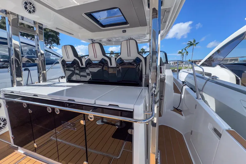 Trade In Yacht Photos Pics 2022 Jeanneau Leader 12.5 WA boat interior with sleek seating and modern design.