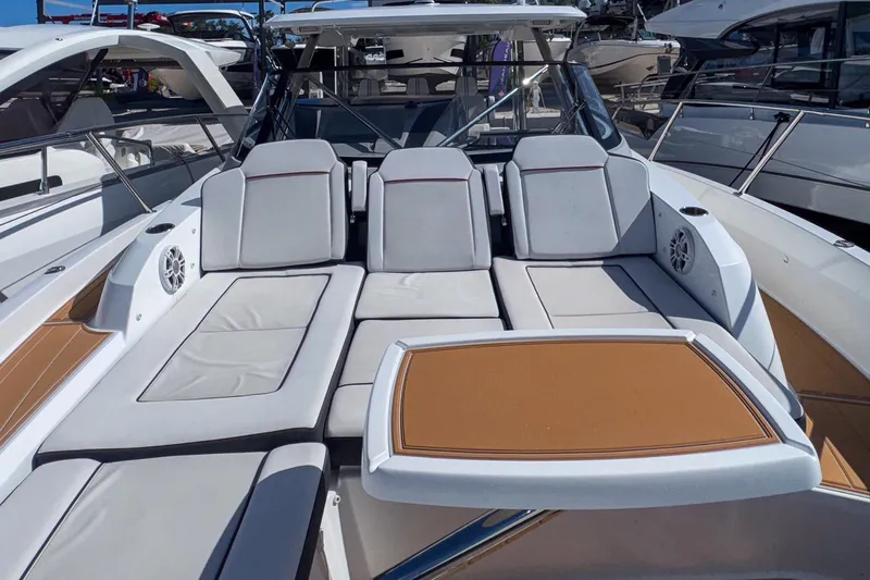 Trade In Yacht Photos Pics Luxurious seating area on 2022 Jeanneau Leader 12.5 WA boat, featuring comfortable cushions and sleek design.