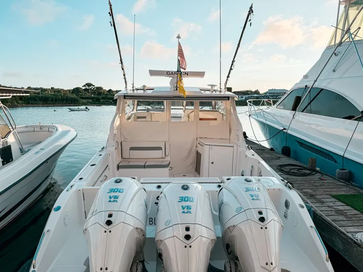  Yacht Photos Pics 2022 Pursuit DC 365 Dual Console boat docked with triple Yamaha 300 V6 engines.