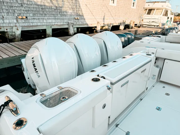  Yacht Photos Pics 2022 Pursuit DC 365 Dual Console boat with Yamaha engines docked at a marina.