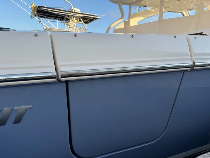  Yacht Photos Pics 2022 Pursuit DC 365 Dual Console boat, close-up of sleek exterior design.