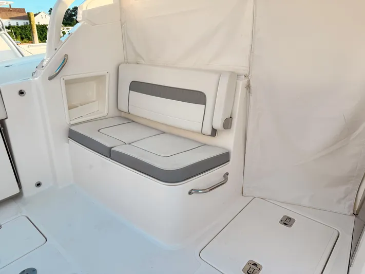  Yacht Photos Pics 2022 Pursuit DC 365 Dual Console interior seating area with white and gray cushions.