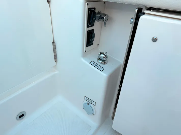  Yacht Photos Pics 2022 Pursuit DC 365 Dual Console boat interior with fresh water access.