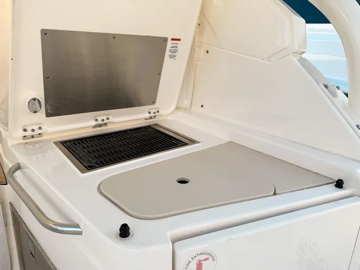  Yacht Photos Pics Outdoor kitchen area on a 2022 Pursuit DC 365 Dual Console boat.