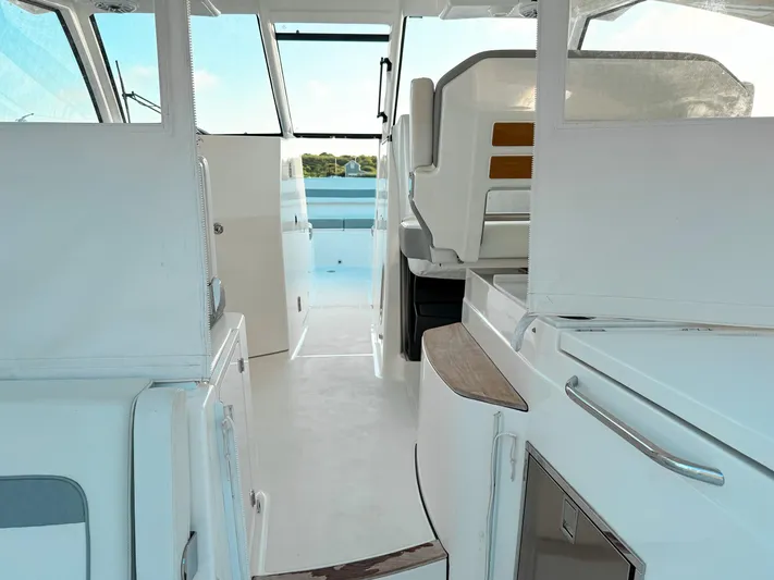  Yacht Photos Pics 2022 Pursuit DC 365 Dual Console interior with sleek design and modern amenities.
