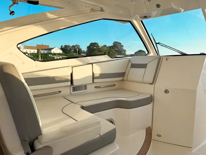  Yacht Photos Pics 2022 Pursuit DC 365 Dual Console interior with luxurious seating and scenic view.