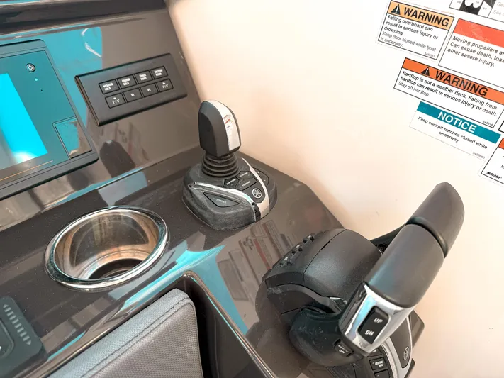  Yacht Photos Pics Control panel of 2022 Pursuit DC 365 Dual Console boat with joystick and throttle.