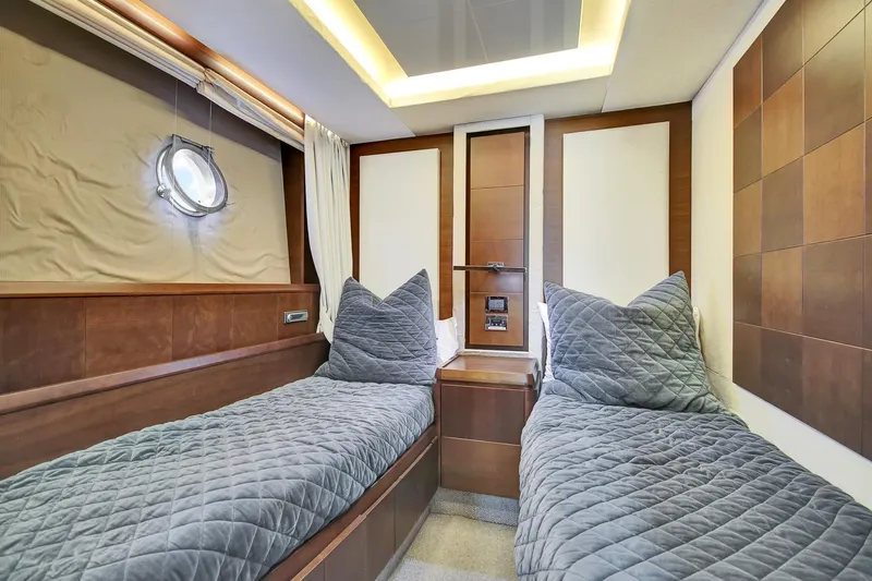  Yacht Photos Pics Luxurious twin cabin interior on 2006 Azimut 75 yacht, featuring modern design and cozy bedding.