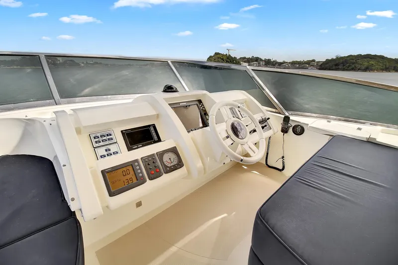  Yacht Photos Pics Helm of 2006 Azimut 75 yacht with modern controls and panoramic view.